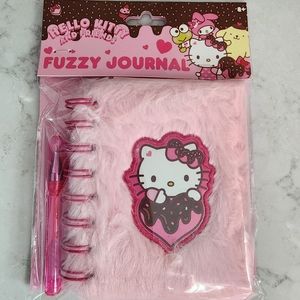 Hello kitty mini notepad and pen.